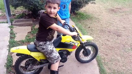 Little kid runs staight into fence with dirt bike