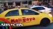 Two quarreling taxi drivers slam each other's cabs