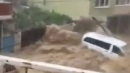 Download Video: Flood turns streets into rivers, tossing around cars