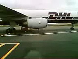 DHL 757 engine surge/back firing