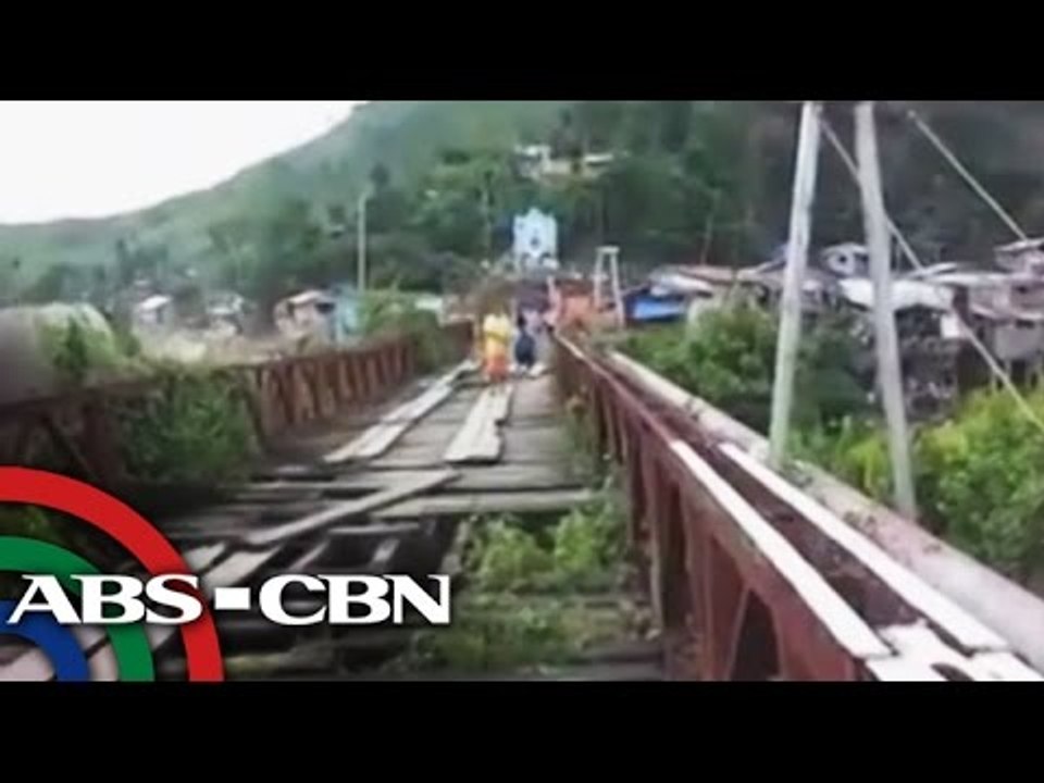 Students cross closed, worn out bridge