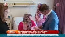 Davutoğlu bebeğin kulağına ezan okudu