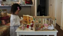 Girl Playing Sylvanian Families Gingerbread House