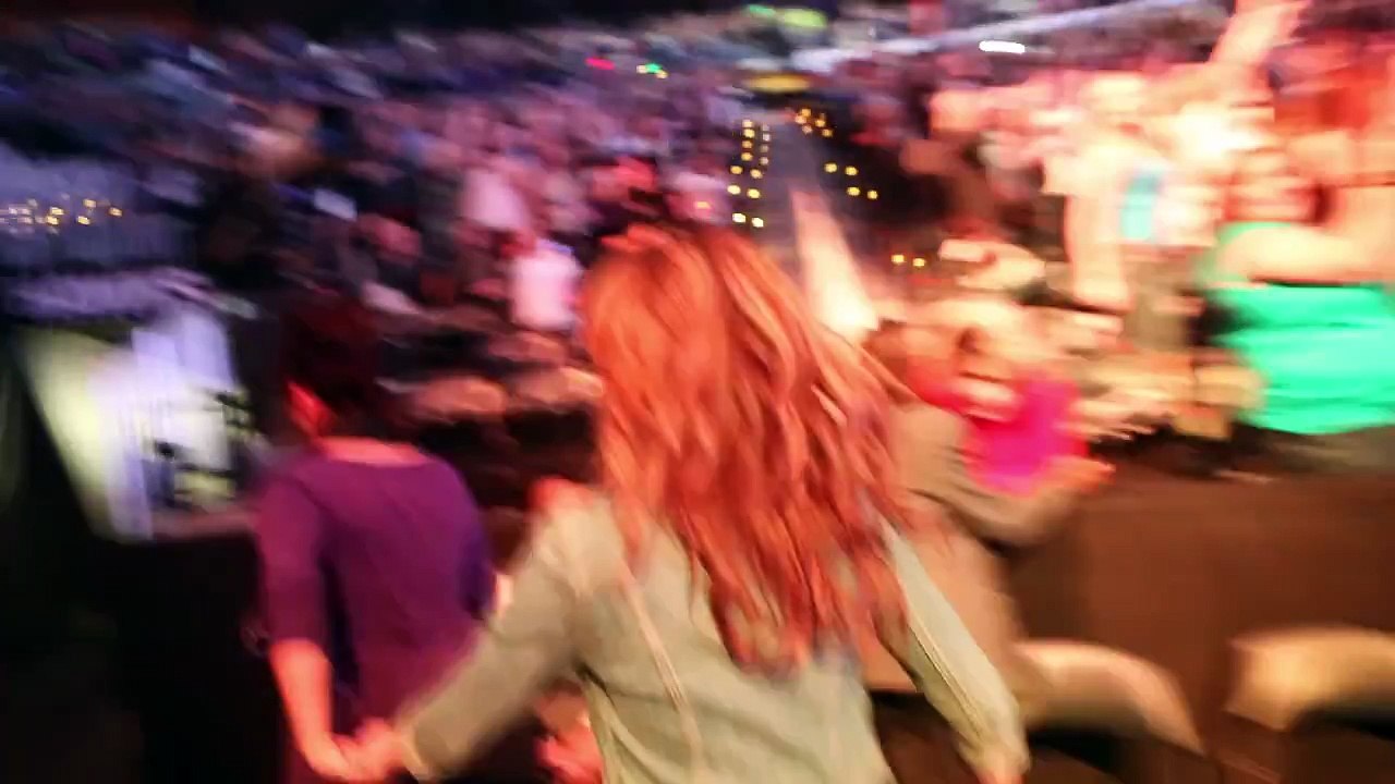 Tori being escorted to the stage as Justin Bieber's "One Less Lonely Girl"