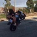 Boy doing stunts on Heavy Bike with his Girl Friends