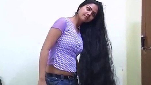 Indian college girl making huge long hair bun - video 