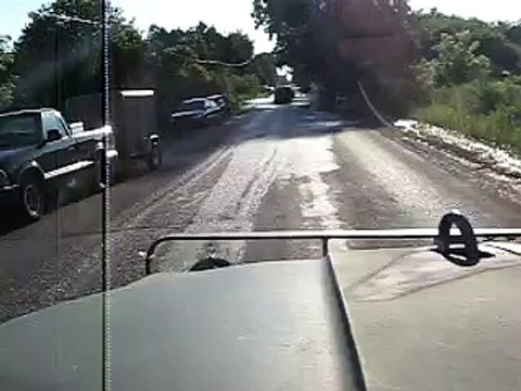 Driver POV driving through flooded road