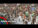 Manila Bay swimmers ignore floating garbage
