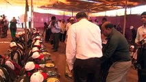 Nandai and Suchitdada serving food to students during Kolhapur Medical & Healthcare Camp