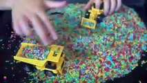 Trucks for children kids Toy construction trucks Sensory activity for toddlers rainbow rice