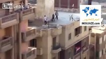 Egyptian protesters thrown from the roof top in Alexandria