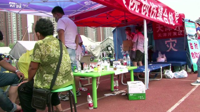 Explosions en Chine: des déplacés logent dans des tentes