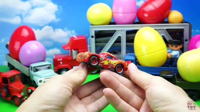 Toy cars for children in large eggs surprises Mack Transporter and trucks