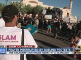Prayer interrupted by dueling protests