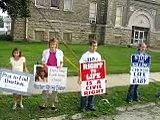 Young Pro-lifers pray as old pro-aborts mock God and life.