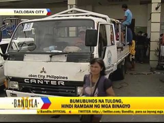 Tacloban grocery store owner gives away goods