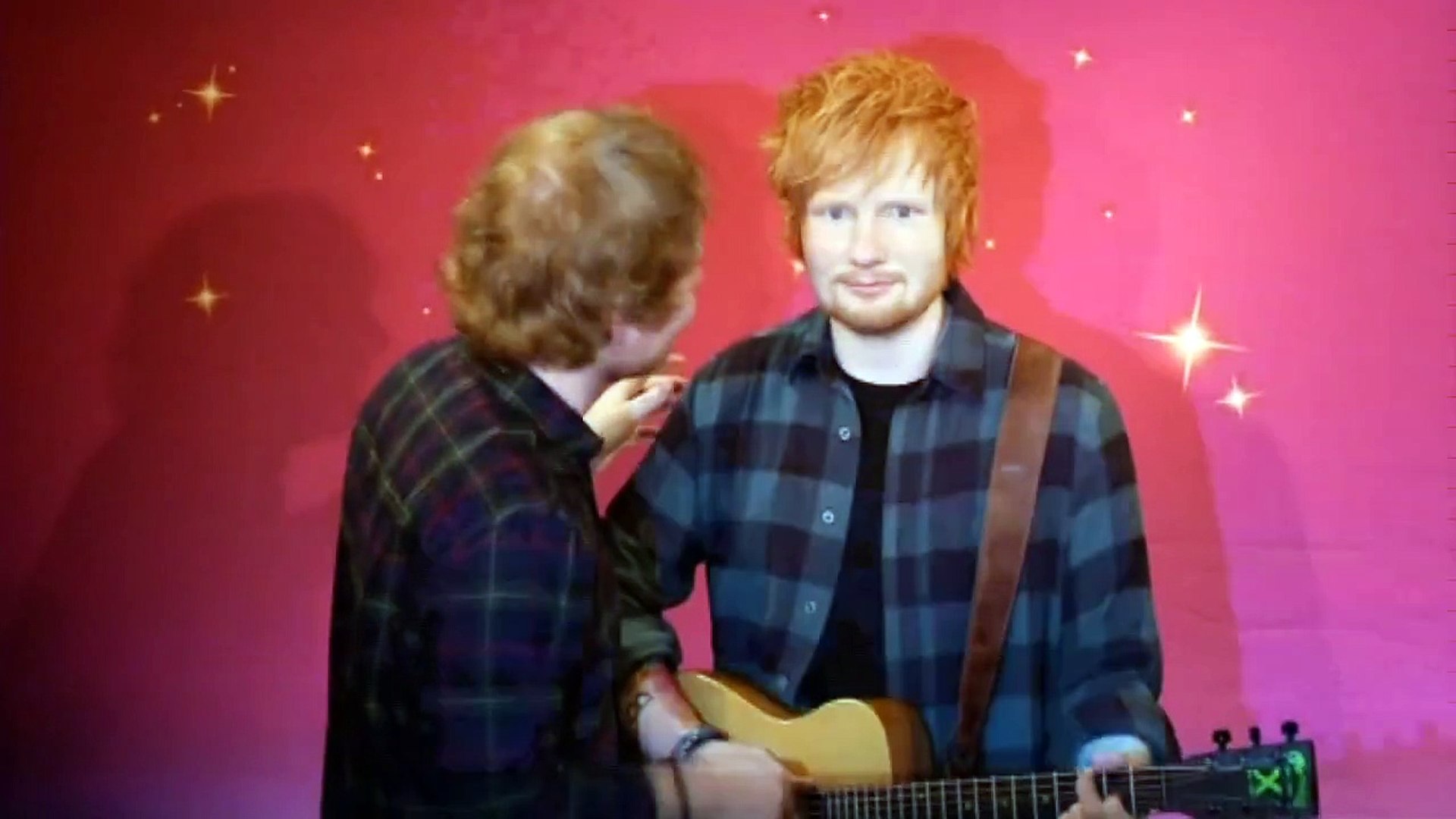 Ed Sheeran takes a selfie with his wax double