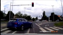 Audi RS6 running red light gets hit by tram