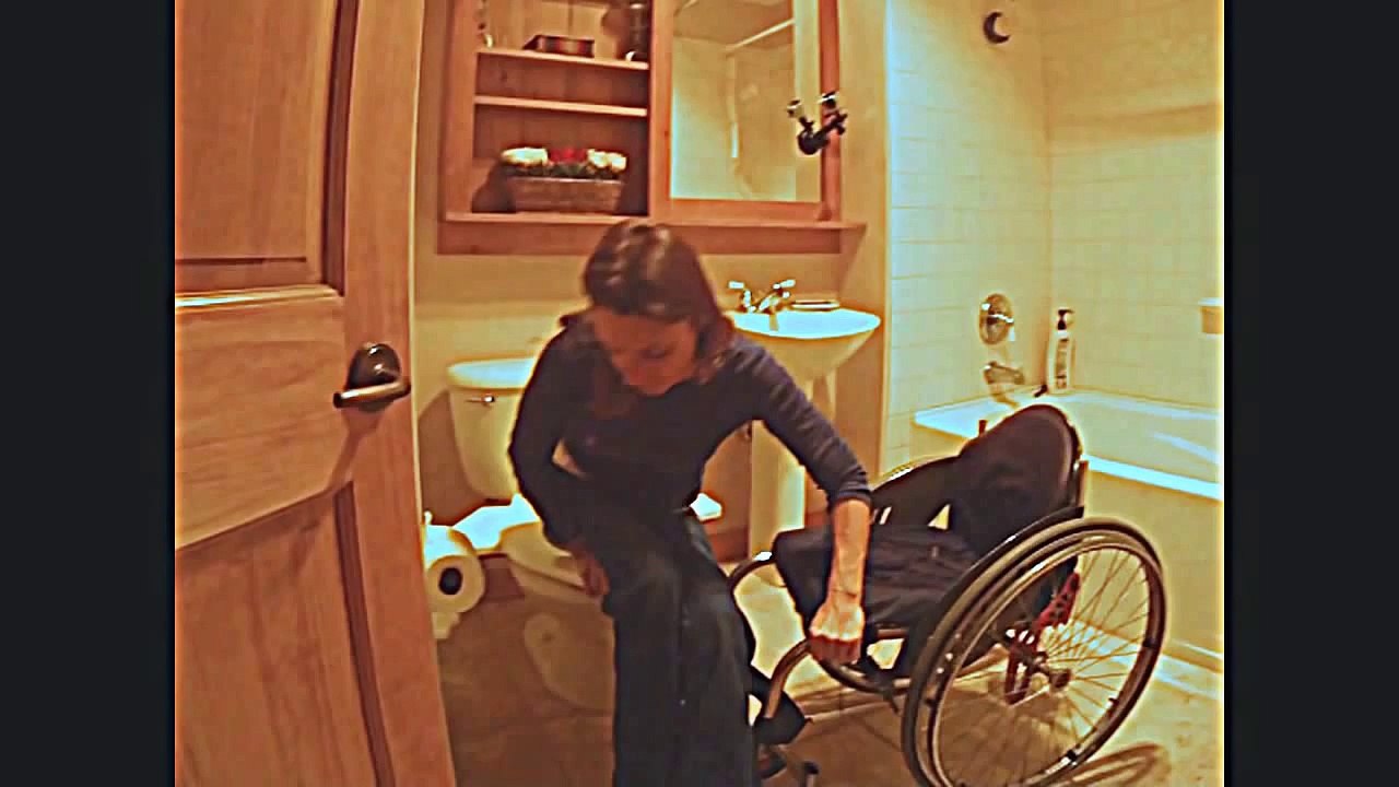 Sarah WIll wheelchair diagonal transfer to WINGMAN toilet seat