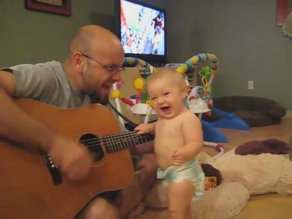 Baby rocks out with dad playing Bon Jovi