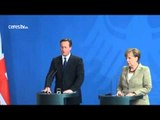 Merkel se abre a negociar con Cameron para mantener al Reino Unido en la UE