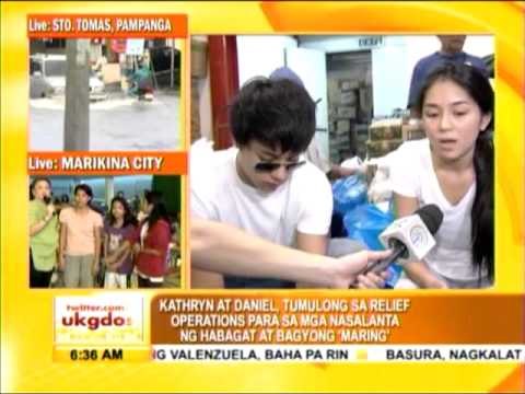 Kathryn, Daniel help repack relief goods