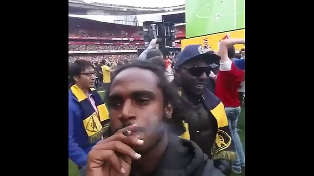 Arsenal fans celebrated winning the FA Cup smoking weed on the pitch at the Emirates Stadium