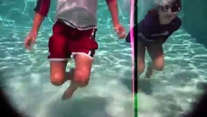 Kids swimming underwater