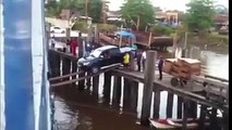 Car Attempting to Load on a Ship over Some Planks