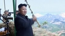 North Korea: Kim Jong Un smiling as he watches military exercises