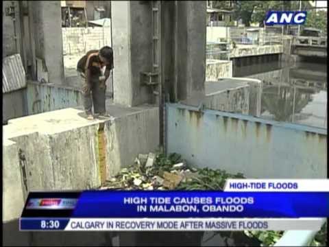 High tide triggers Malabon, Bulacan floods