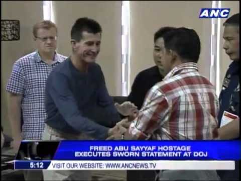 Freed Aussie hostage goes to DOJ