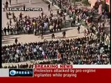 Christians protecting Muslims during their prayers in Tahrir Square - Egypt