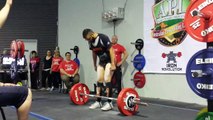 A man vomits, lifting the barbell weighing 190kg