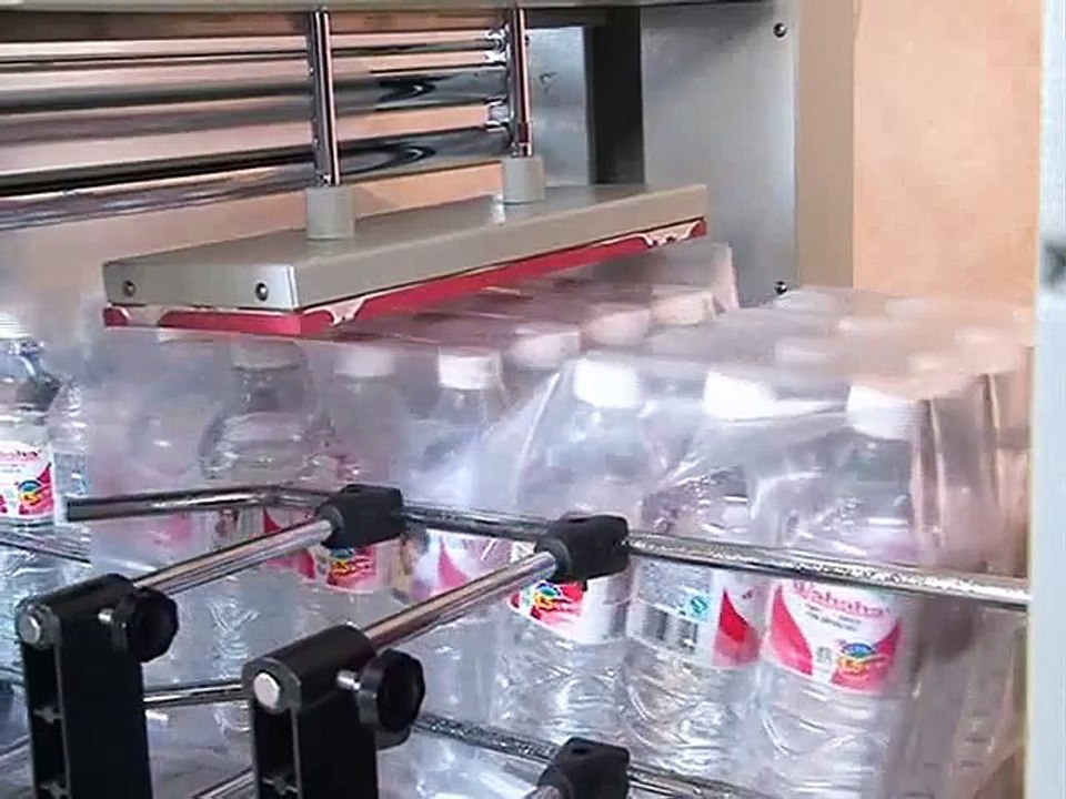 Máy rút màng co lốc chai PE ,máy co log chai(lon) nước ngọt, nước suối, máy đóng gói màng co lốc 8 chai 12 chai