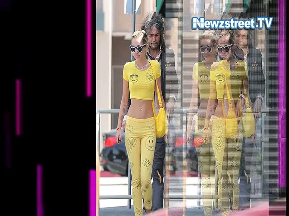 Miley Cyrus ditches bra for yellow tiny crop-top