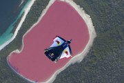 Wingsuit Flying Over A Pink Lake