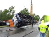 Crane lifts a truck