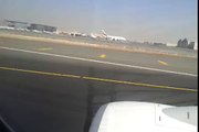 اقلاع طائرة من مطار دبي تصوير من داخل الطائرة