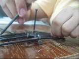 Balancing multiple nails on a single one