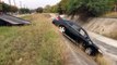 Tow Truck Driver Pulls Car Out Of Ditch