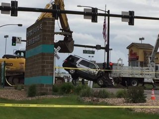 Officer's patrol car lifted from sinkhole