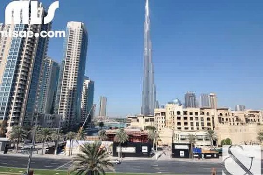 A bright two bedroom apartment with views of the Boulevard fountain Burj Khalifa from the balcony. - mlsae.com