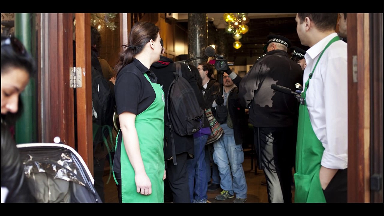 UK Uncut protest cuts to women services at 45 Starbucks around the UK