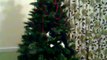kitty cat climbs un decorated christmas tree