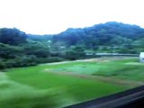 On the Shinkansen from Tokyo to Kyoto going 300 km/hr.