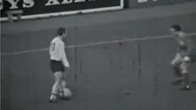 Ian St John punches an opponent