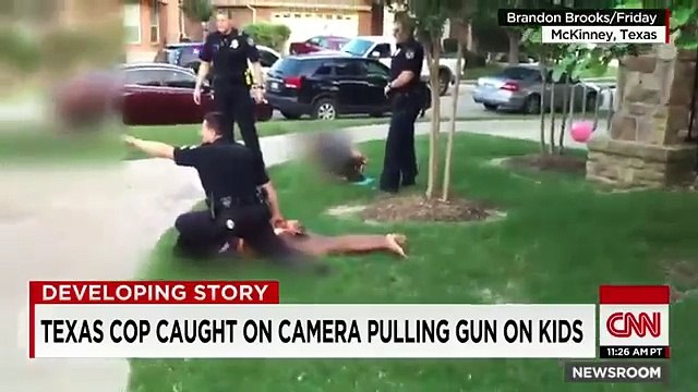 Texas cop caught on camera pulling gun on kids