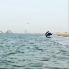Wow two wheeling of land cruiser over the sea water