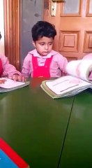 a little kid sleeping in class room